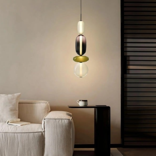 Candy. Playful. Unmistakably Modern.  These sculptural pendant lights bring together color and form—each one a hanging work of art. Whether placed over a bar, bedside, or dining space, they transform light into a statement.  Light that doesn’t just illuminate—it expresses.