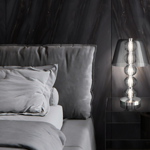 Sculptural glow by your side. This table lamp merges art and light into one graceful form—refined, reflective, and quietly luxurious.  Perfect for moments of calm, elegance, and atmosphere.